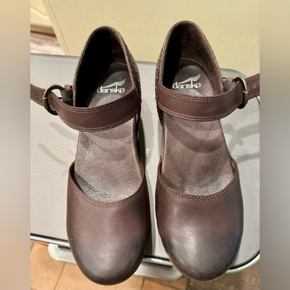 Dansko Sam clog in smooth brown leather.